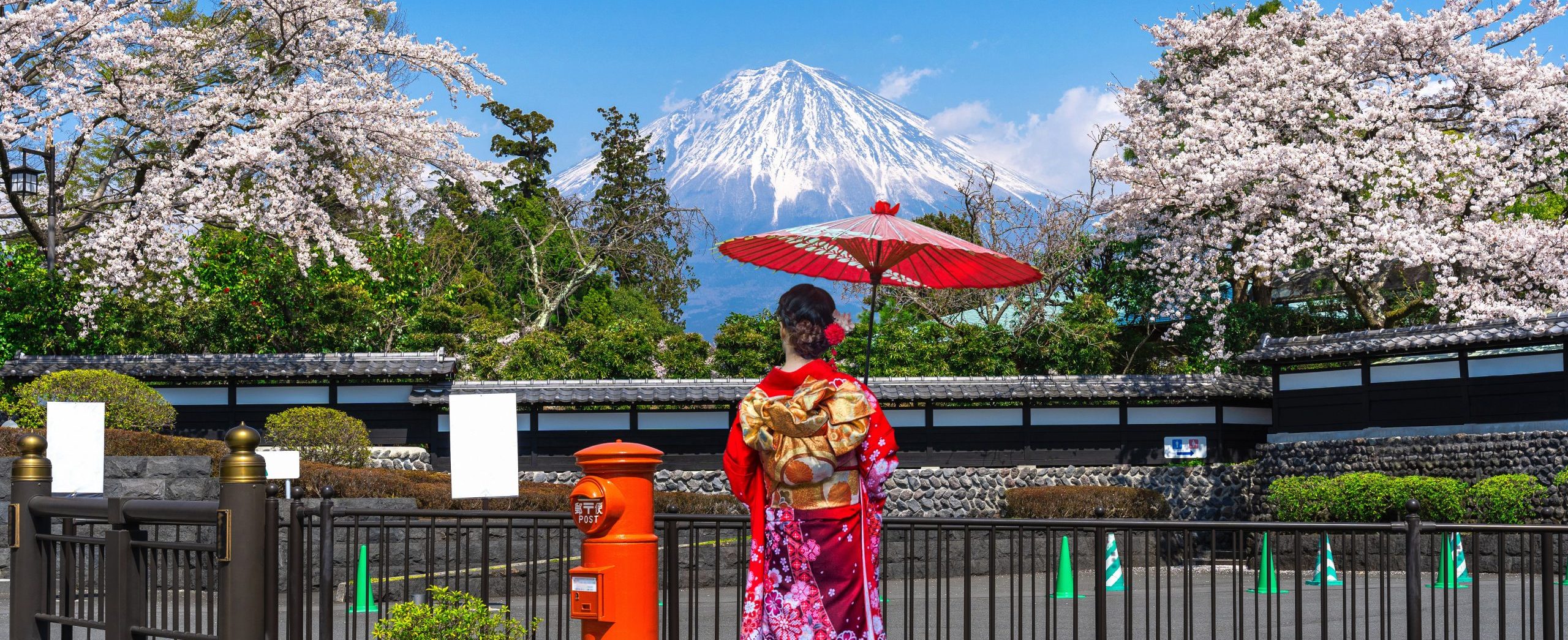 Asian woman wearing japanese traditional kimono at Fuji mountain