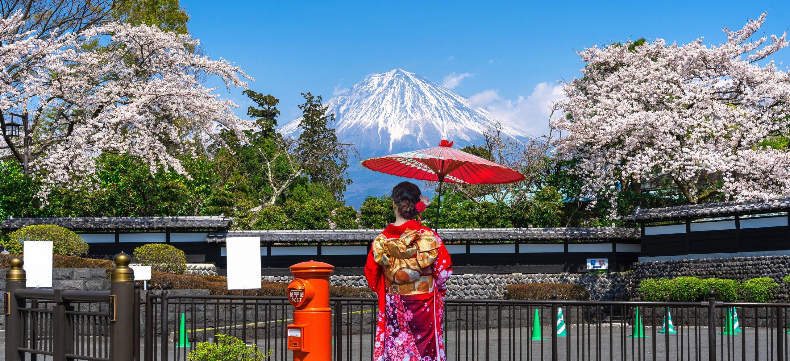 Asian woman wearing japanese traditional kimono at Fuji mountain